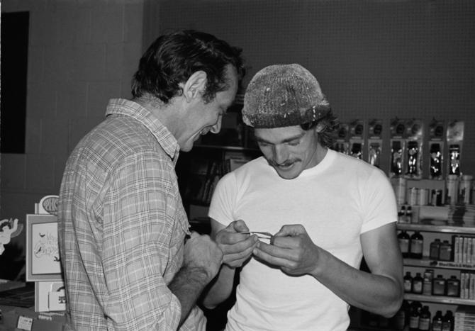 Harvey Milk shares the daily comic strip with friend Denton Smit